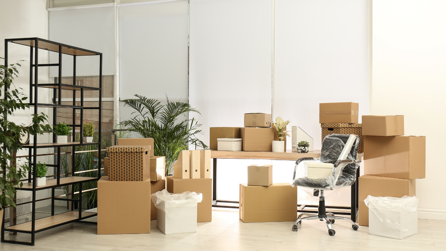 A room filled with lots of boxes and a chair