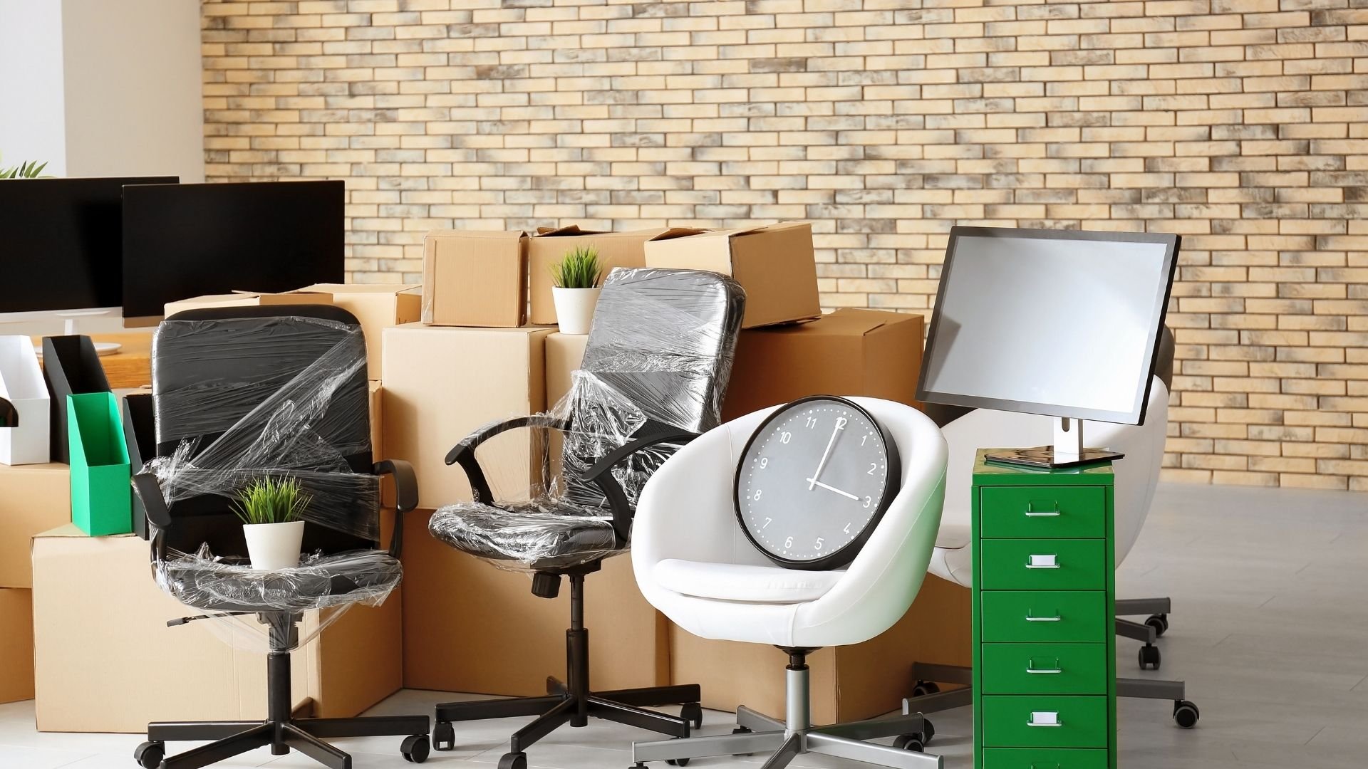 Office furniture and supplies packed for a commercial relocation